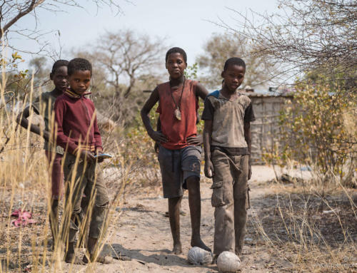 Boys playing soccer close to the border control of Angola and Namibia, Chetto, Namibia